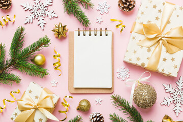 Christmas blank greeting card mock-up scene. Creative layout made of Christmas tree branches and paper card note. Flat lay. Nature New Year concept