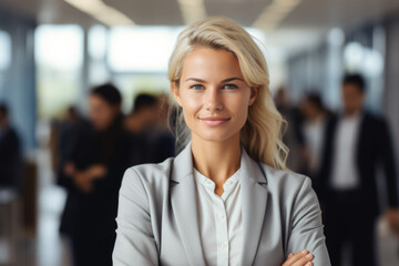Fototapeta premium Professional businesswoman standing confidently with her arms crossed. Perfect for corporate presentations and marketing materials.