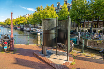 Amsterdam open air pissoir urinals. Public toilet for men along the canal