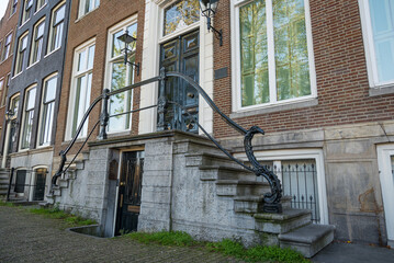Traditional Dutch Baroque and Gothic old architecture in Amsterdam from 17th century.