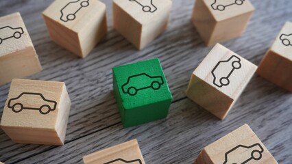 Wooden blocks with car icon. Transportation and buying a right car concept. - obrazy, fototapety, plakaty