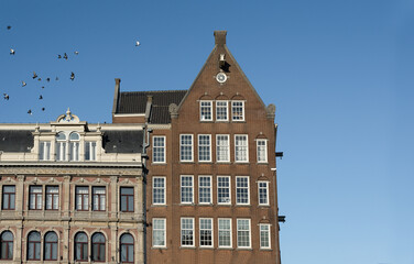 Fototapeta na wymiar Traditional Dutch Baroque and Gothic old architecture in Amsterdam from 17th century.