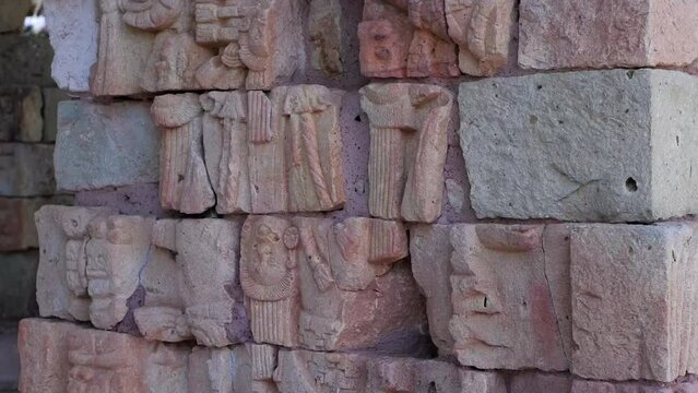 Tilt up ancient carved temple stones, glyphs at Mayan Copan ruins, HND