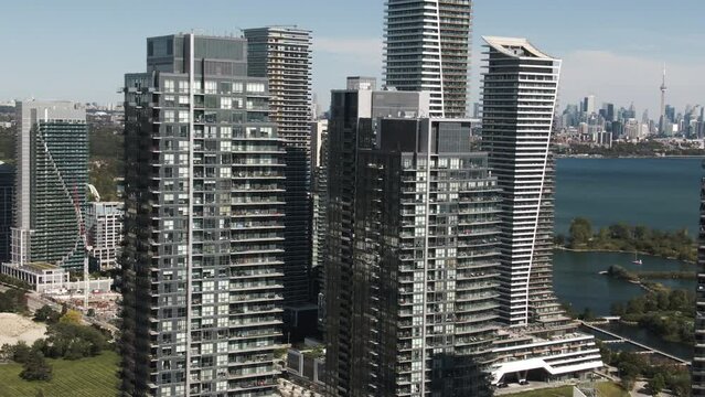Glass and concrete skyscrapers of Lake Ontario are shining above the ground on a sunny day