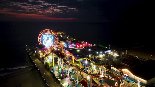 Santa Monica Pier At Los Angeles In California United States. Colored Amusement Park Pier. Ferris Wheel Landscape. Santa Monica Pier At Los Angeles In California United States. 