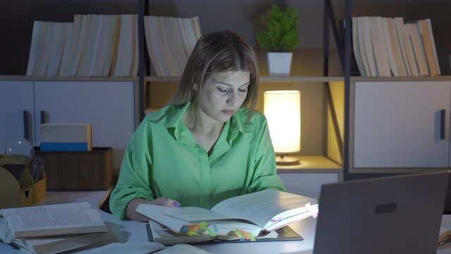 Researcher woman reading a book.