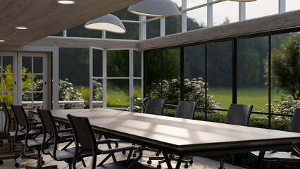 A modern meeting room with large glass ceiling and wall, and a green nature outdoor view.