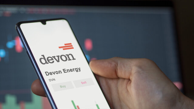 November 6th 2023 Oklahoma City, Oklahoma. The logo of Devon Energy on the screen of an exchange. Devon Energy price stocks, $DVN on a device.