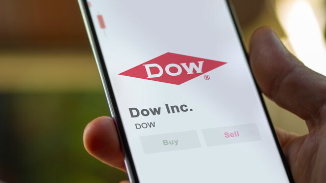 Dow Inc. on the screen of an exchange. Dow Inc  price stocks, $DOW on a device, logo.