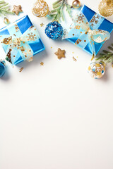 Vertical Christmas background with blue and gold decorations, gift boxes on white background. Top...