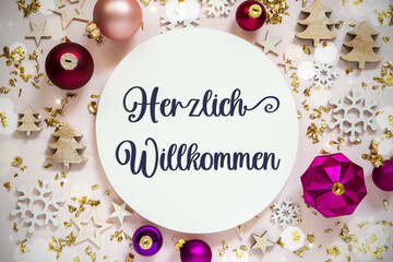 Fototapeta na wymiar Text Herzlich Willkommen, Means Welcome, Purple Flatlay Christmas Decor