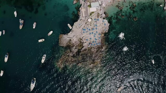 Rising aerial view of a unique resort shoreline in Italy.