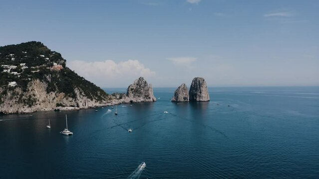 Wide aerial view of Capri, Italy's tranquil waters on a mid summer day.