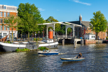 Amsterdam lift bridge canal river with boats
