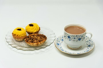 Walnut pie, lemon tart, hot tea with milk