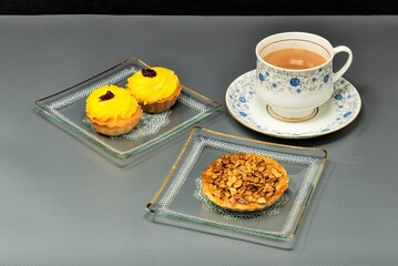 Walnut pie, lemon tart, hot tea with milk
