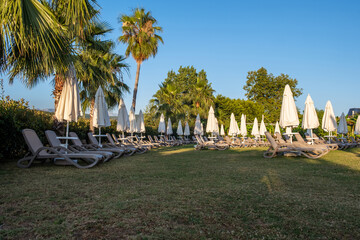 Relax on the hotel grounds or in the garden, green grass and tourist recreation. Sunbathing area...