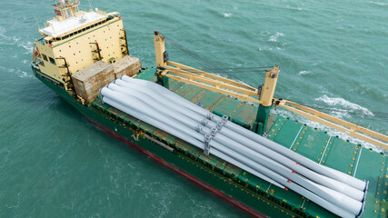 Wind Turbine on Ship, Transportation of blades for wind turbines on a cargo ship. Heavy load...