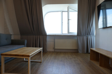 A window with a view of the city in the apartment