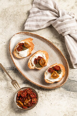 Fototapeta premium Bruschetta with sun-dried tomatoes, appetizer