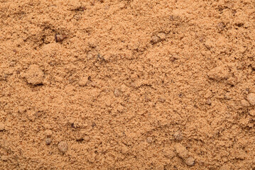 Background of brown sugar granules. Natural sweeteners are a healthy food choice.