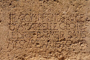 Detail of the emorial stone dedicated to the French writer Albert Camus, Tipaza, Tipasa, Algeria. Text : glory means to love unconditionnaly.