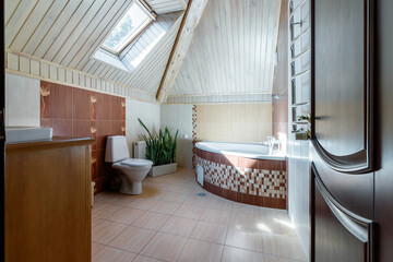 A spacious bathroom with heated floors, a separate bathroom, shower, double shell and windows - obrazy, fototapety, plakaty