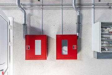 A red fire shield is installed in the corridor of an apartment building