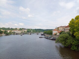 Fototapeta na wymiar View of Vltava river at Prague city, Czech Republic with Manes bridge in background.