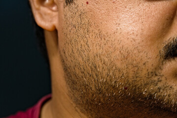 partially blurred side view of face of Indian adult male - obrazy, fototapety, plakaty