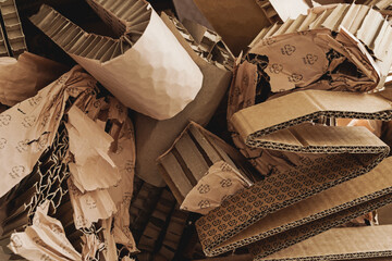 Closeup shot of pile of Cardboard Waste with PAP symbol. Concepts of Paper Recycling and Waste Sorting - obrazy, fototapety, plakaty