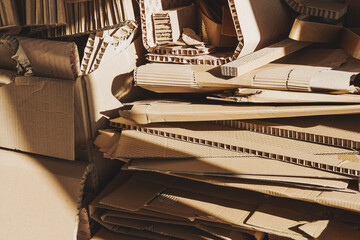 Stack of Cardboard Waste in sunlight. Concepts of Paper Recycling and Waste Sorting
