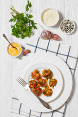 bang bang broccoli bites on plate, top view