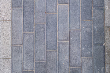 Fototapeta premium abstract background of grey tiles on the track in the park