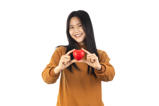 Asian Young Woman holding red heart isolated on white background with clipping path. health insurance, donation, happy charity volunteer concept, world mental health day, world heart day, csv concept