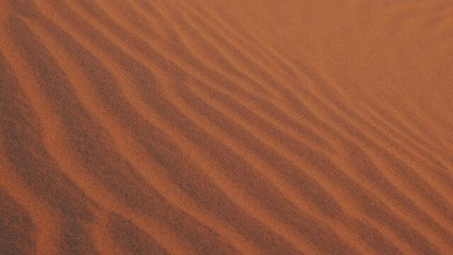 Detail of sand texture lines in the desert dunes.