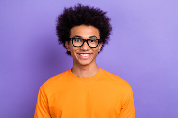 Fototapeta premium Portrait of cheerful intelligent young man toothy smile good mood wear eyeglasses isolated on purple color background