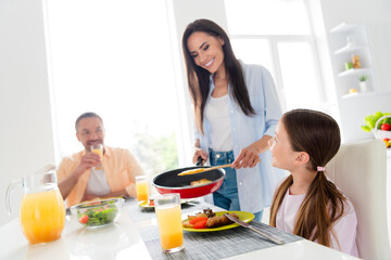 Photo of idyllic friendly people have good mood enjoy prepare eat domestic food kitchen table house indoors
