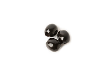 Tasty black olives with leaves isolated on white background. Fresh fruit olives on a white background.