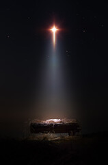 A bright and large star shines brightly, blessing baby Jesus in the manger of the stable. A background and concept that celebrates Christmas and suggests the birth and death of Jesus on the cross.
 - obrazy, fototapety, plakaty