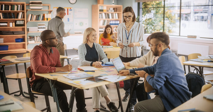 Diverse Multiethnic Young and Senior Adults Having a Fun Quiz Game Team Assignment, Undergoing a Workforce Training Program for Improving Connections and Relationships Between Employees