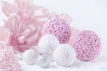 Merry Christmas. Christmas banner in pink color on a white Christmas background. Christmas background, pink xmas holiday card. Christmas card pink balls