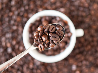 Roasted coffee beans forming a background pattern