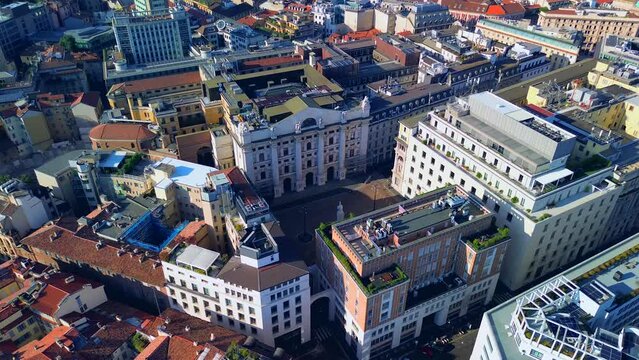 Aerial view of the Borsa Piazza Affari. Krishi houses in the city. Attractions for tourists. A crisis. Statue of the middle finger on the hand. Finance. Architecture. Italy, Milan, 10.2023