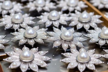 Fototapeta na wymiar unfinished pearl brooches on the assembly line
