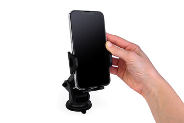 Hand putting mobile phone on car phone holder isolated on white background.
