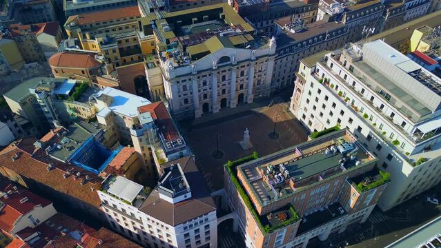 Aerial view of the Borsa Piazza Affari. Krishi houses in the city. Attractions for tourists. A crisis. Statue of the middle finger on the hand. Finance. Architecture. Italy, Milan, 11.11.2023