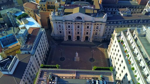 Aerial view of the Borsa Piazza Affari. Krishi houses in the city. Attractions for tourists. A crisis. Statue of the middle finger on the hand. Finance. Architecture. Italy, Milan, 11.11.2023