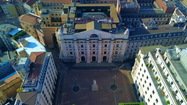 Aerial view of the Borsa Piazza Affari. Krishi houses in the city. Attractions for tourists. A crisis. Statue of the middle finger on the hand. Finance. Architecture. Italy, Milan, 10.2023