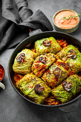 Savoy cabbage stuffed with mushrooms, vegetarian dish, vertical photo